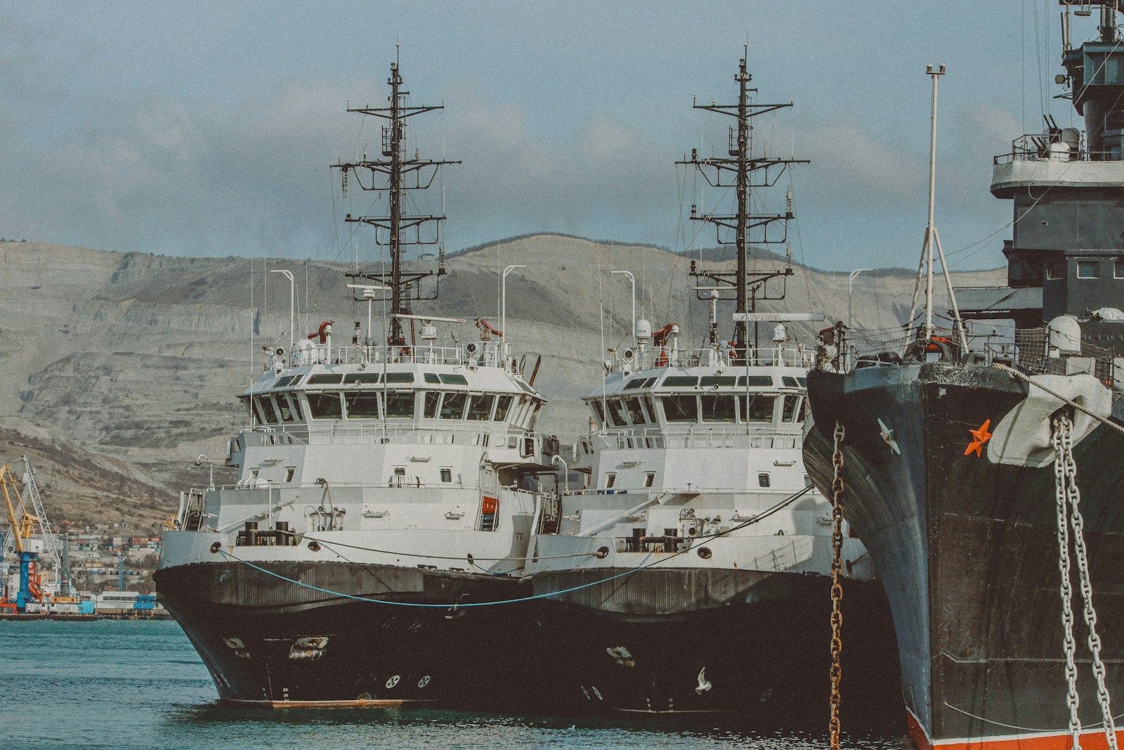 A couple of ships that are sitting in the water